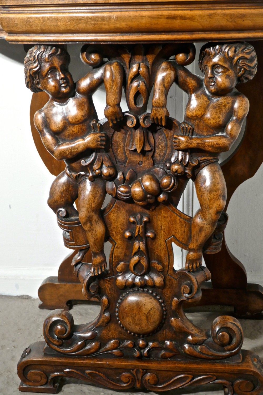A pair of 19th Century Ornately Carved Walnut Rocco Console Tables  View II
