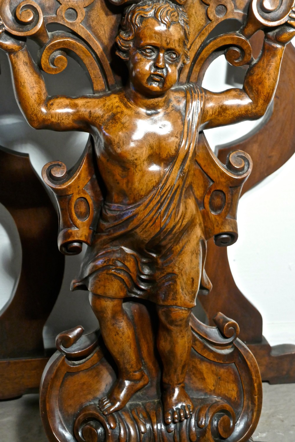 A pair of 19th Century Ornately Carved Walnut Rocco Console Tables  View IV
