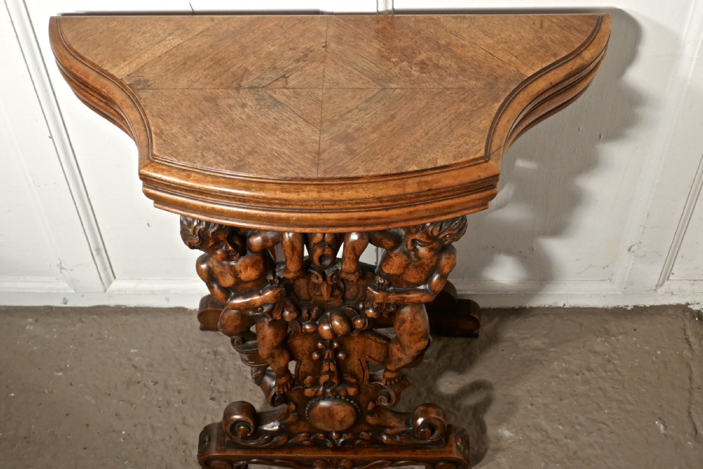 A pair of 19th Century Ornately Carved Walnut Rocco Console Tables  View V