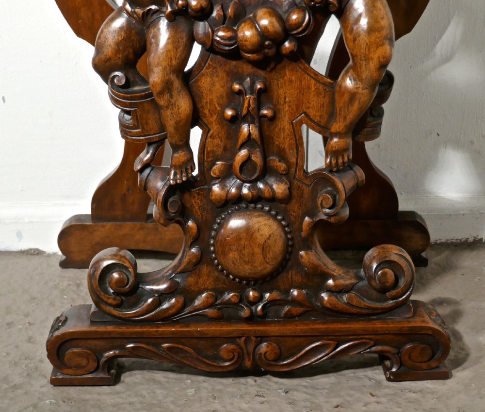 A pair of 19th Century Ornately Carved Walnut Rocco Console Tables  View VI