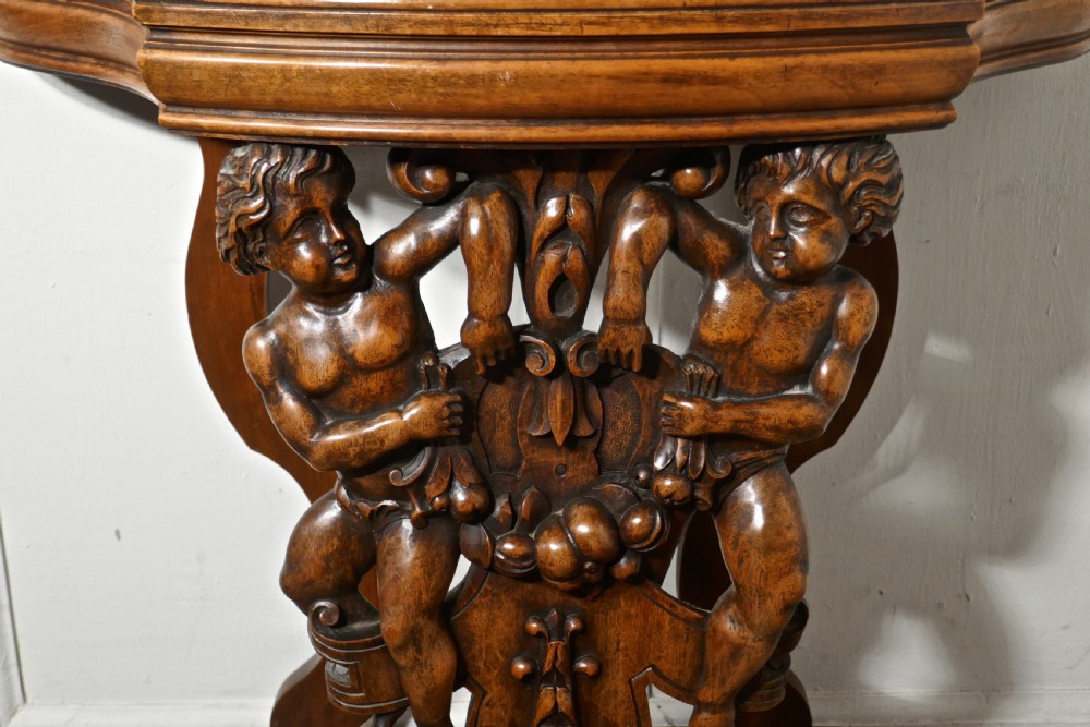 A pair of 19th Century Ornately Carved Walnut Rocco Console Tables  View VII