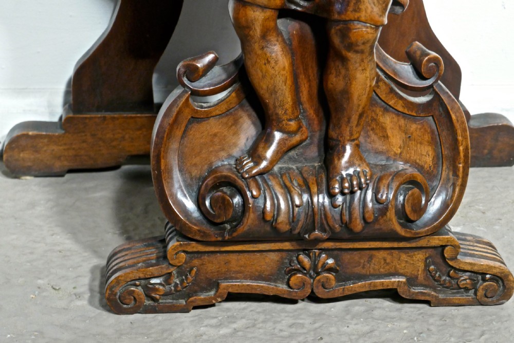 A pair of 19th Century Ornately Carved Walnut Rocco Console Tables  View VIII