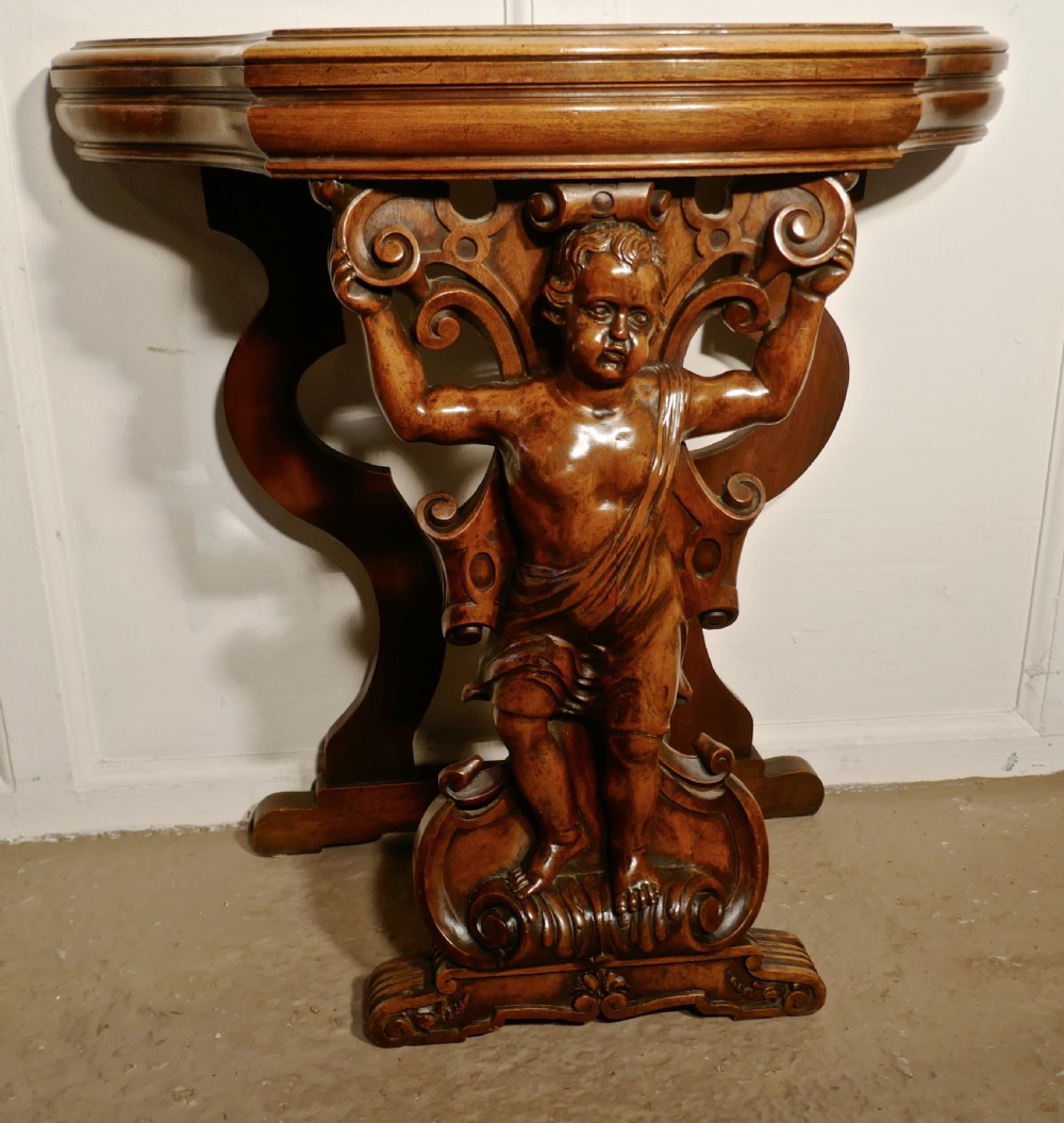 A pair of 19th Century Ornately Carved Walnut Rocco Console Tables  View X