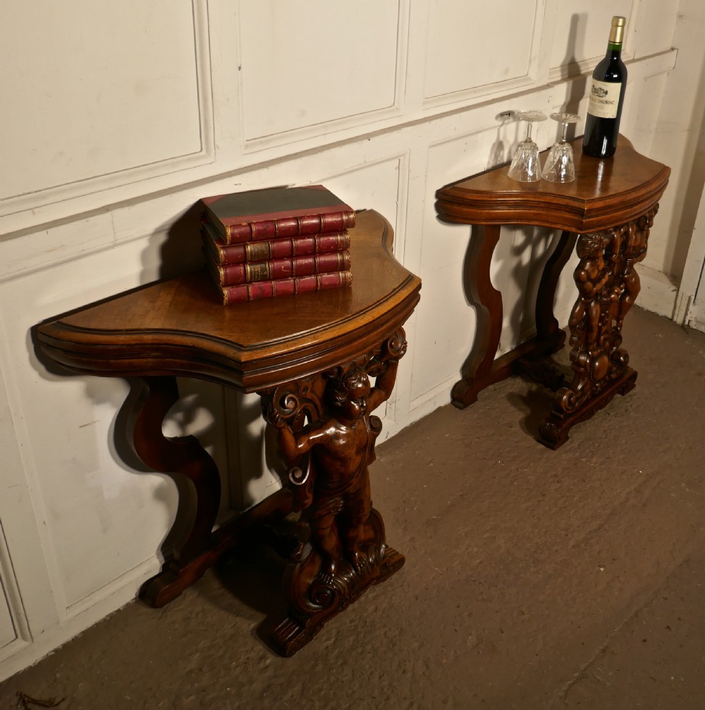 A pair of 19th Century Ornately Carved Walnut Rocco Console Tables  View XI