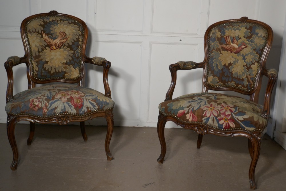 A pair of French Arts and Crafts Walnut Salon Chairs 