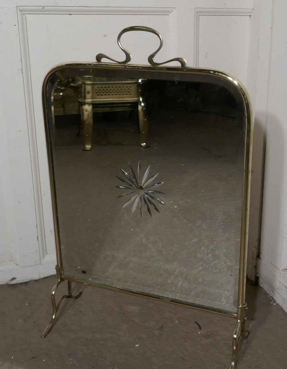 A Victorian Art Nouveau Brass and Sunburst Mirror Fire Screen