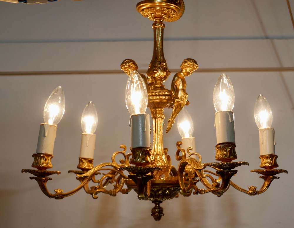 A French Gilded Brass 6 Branch Rococo Cherub Chandelier 