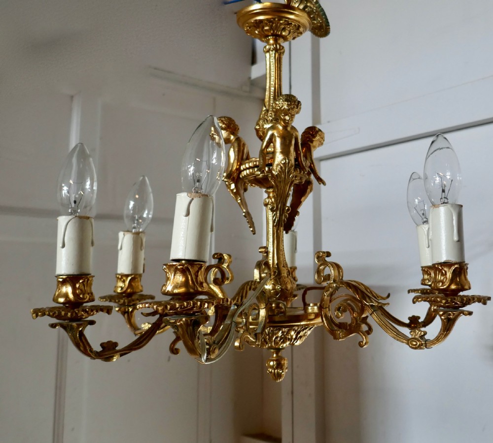 A French Gilded Brass 6 Branch Rococo Cherub Chandelier  View VII