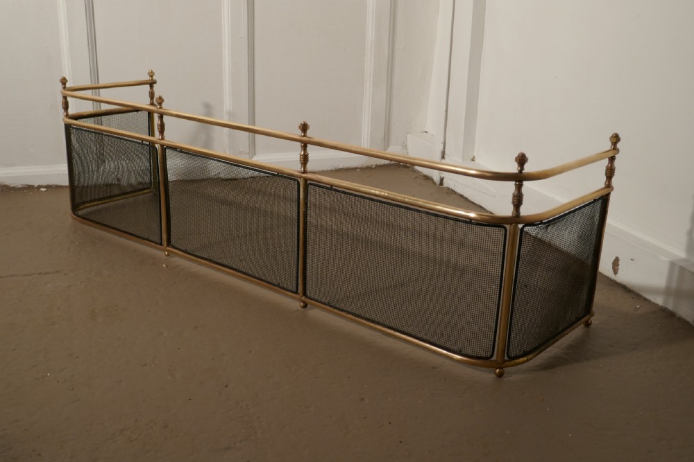 A Large Victorian Brass Club Fender 