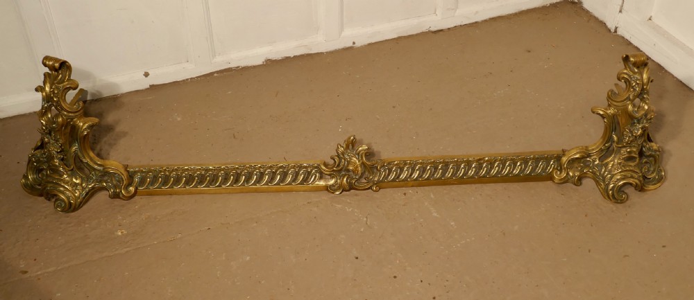 Large French Rococo Brass Extending Fender with Decorative Chenets  View III