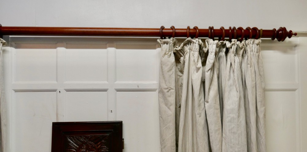 A Very Long Victorian Mahogany Curtain Pole with Rings View III
