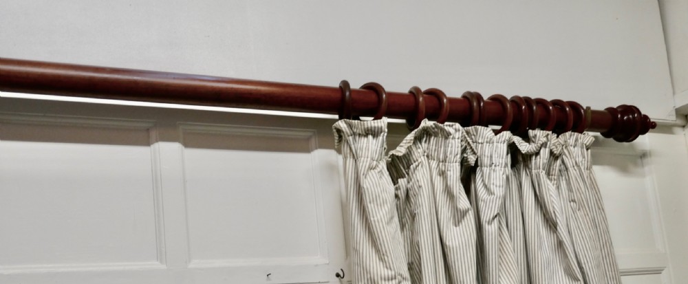A Very Long Victorian Mahogany Curtain Pole with Rings View VI