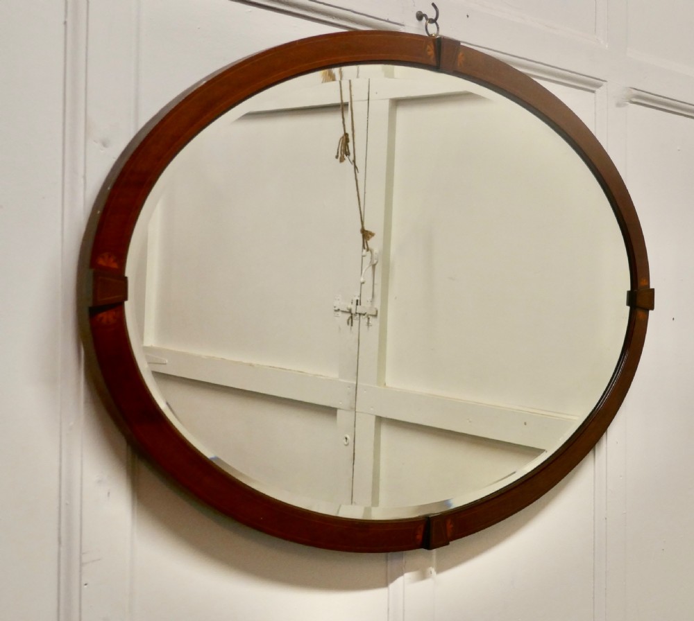 A Large Edwardian Inlaid Mahogany Oval Mirror View II