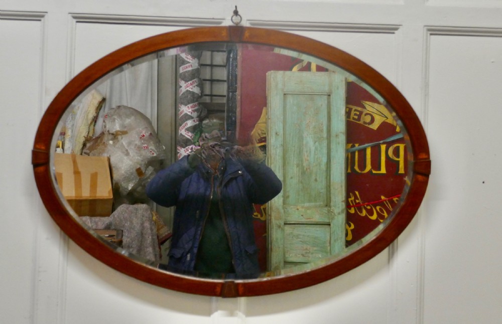 A Large Edwardian Inlaid Mahogany Oval Mirror View III