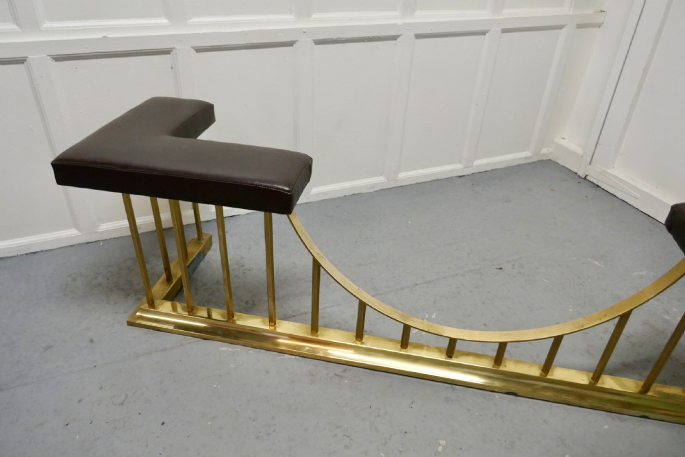 A Large Brass and Leather Club Fender View III