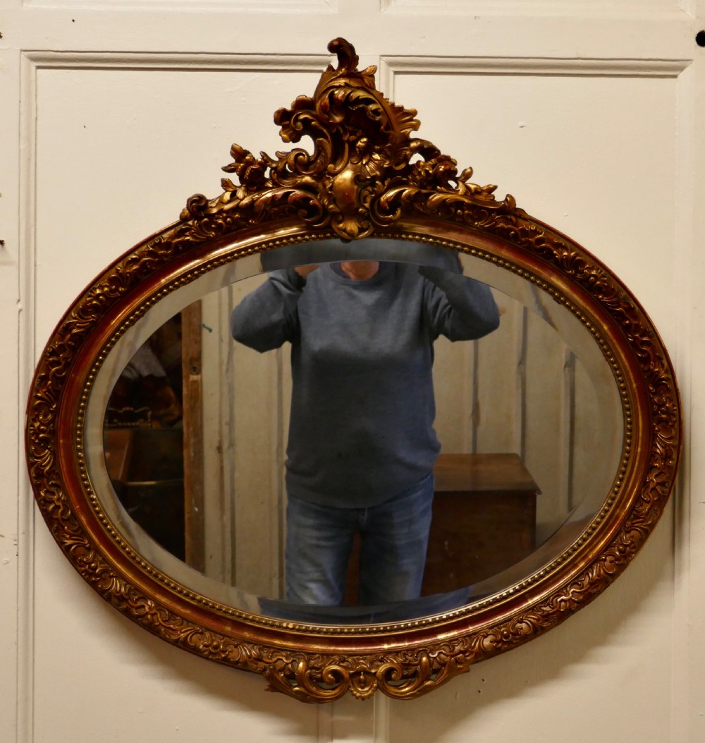 A Superb Late 19th Century Regency Style Oval Gilt Mirror View VI