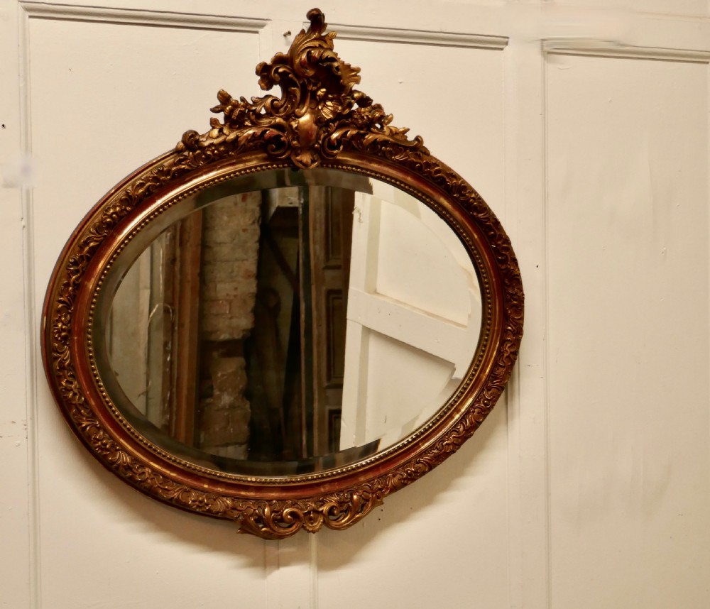 A Superb Late 19th Century Regency Style Oval Gilt Mirror View VII