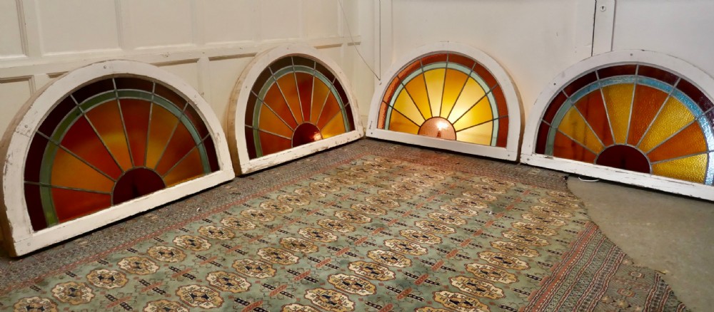 A Set of 4 Large Art Deco Arched Sunburst Stained Glass Windows