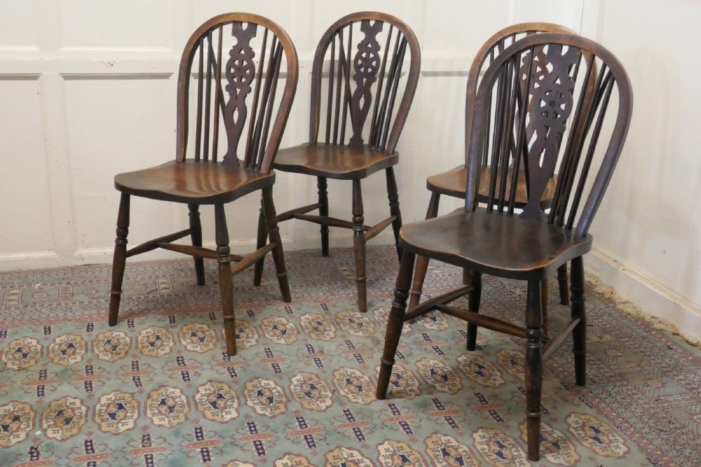 A Set of 4 Beech & Elm Wheel Back Windsor Kitchen Dining Chairs View II