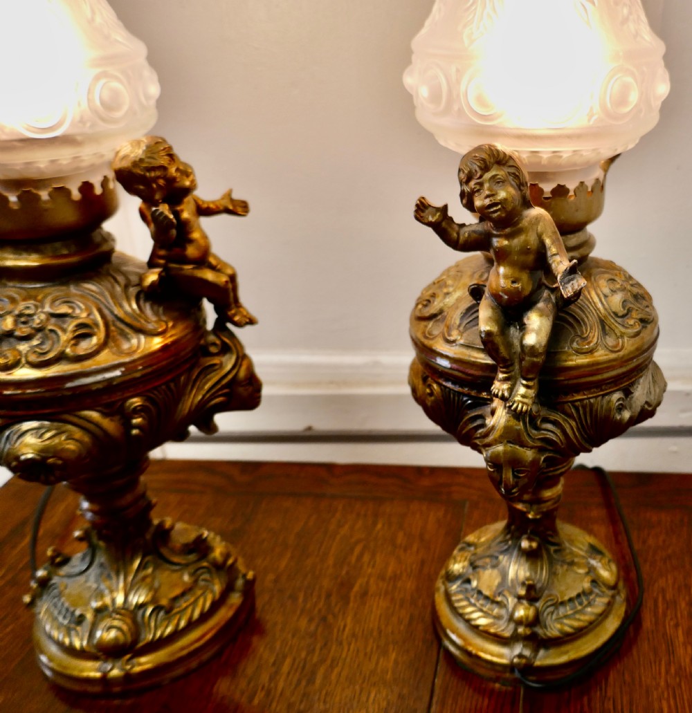 A Pair of  19th Century French Gilt Lamps in the form of Cherubs or Putti   View VI