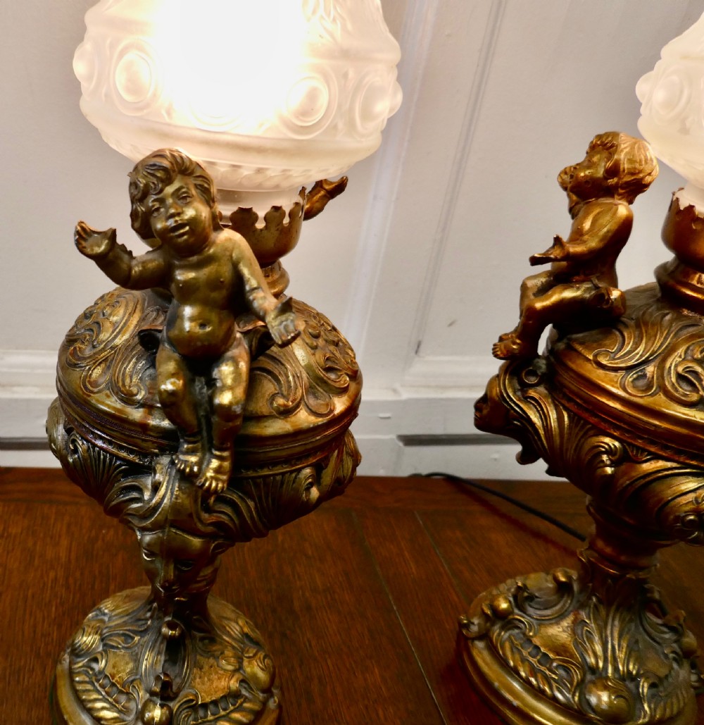 A Pair of  19th Century French Gilt Lamps in the form of Cherubs or Putti   View VII