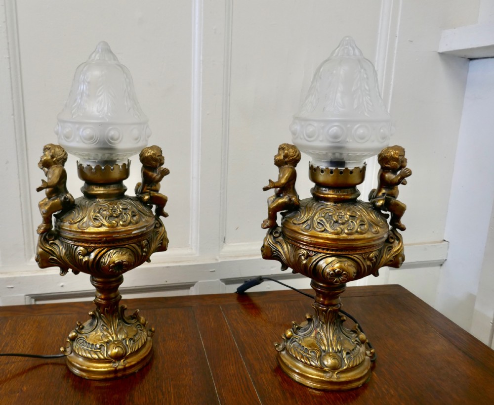 A Pair of  19th Century French Gilt Lamps in the form of Cherubs or Putti   View IX