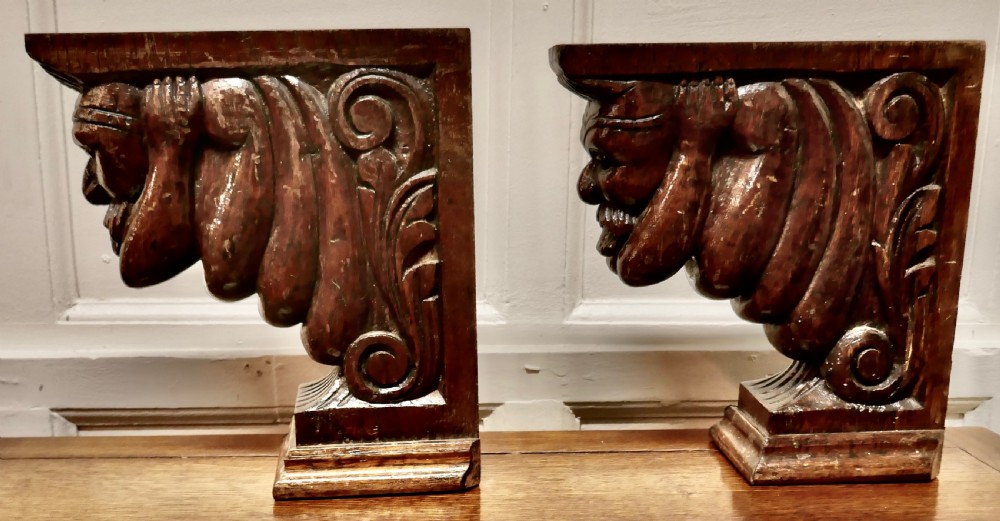 A Pair of Carved Oak Wall Brackets Caryatid Guardians View II