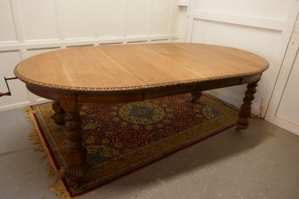 A Large Victorian  Golden Oak Oval Extending Dining Table  View III