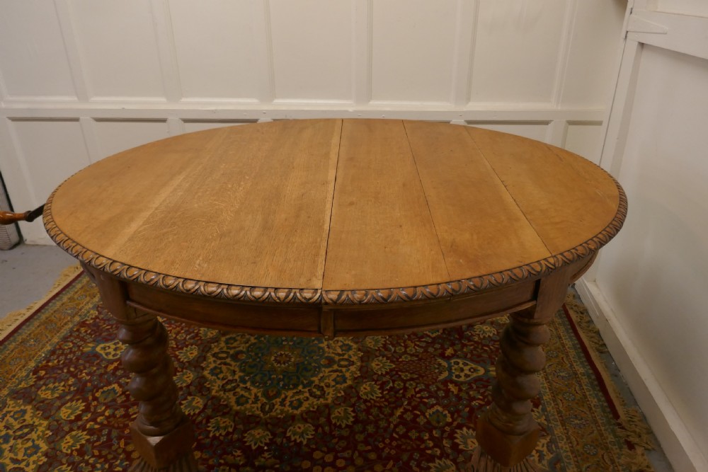 A Large Victorian  Golden Oak Oval Extending Dining Table  View IX