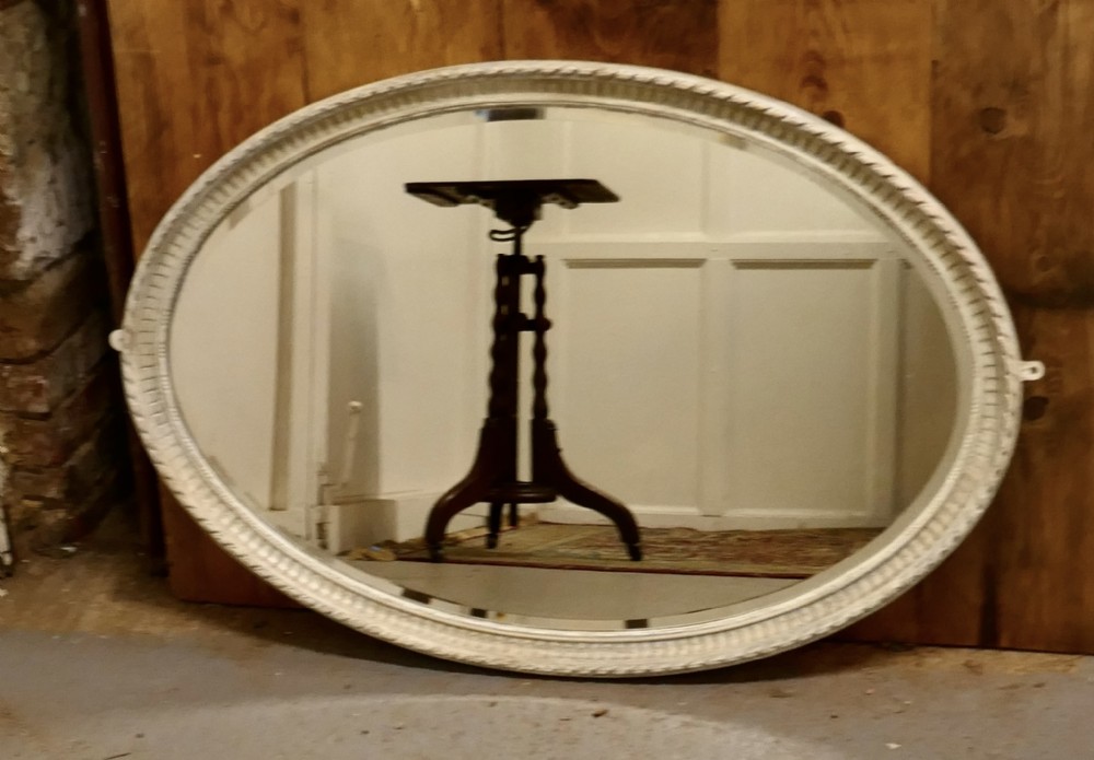 A Large Edwardian Painted Oval Mirror