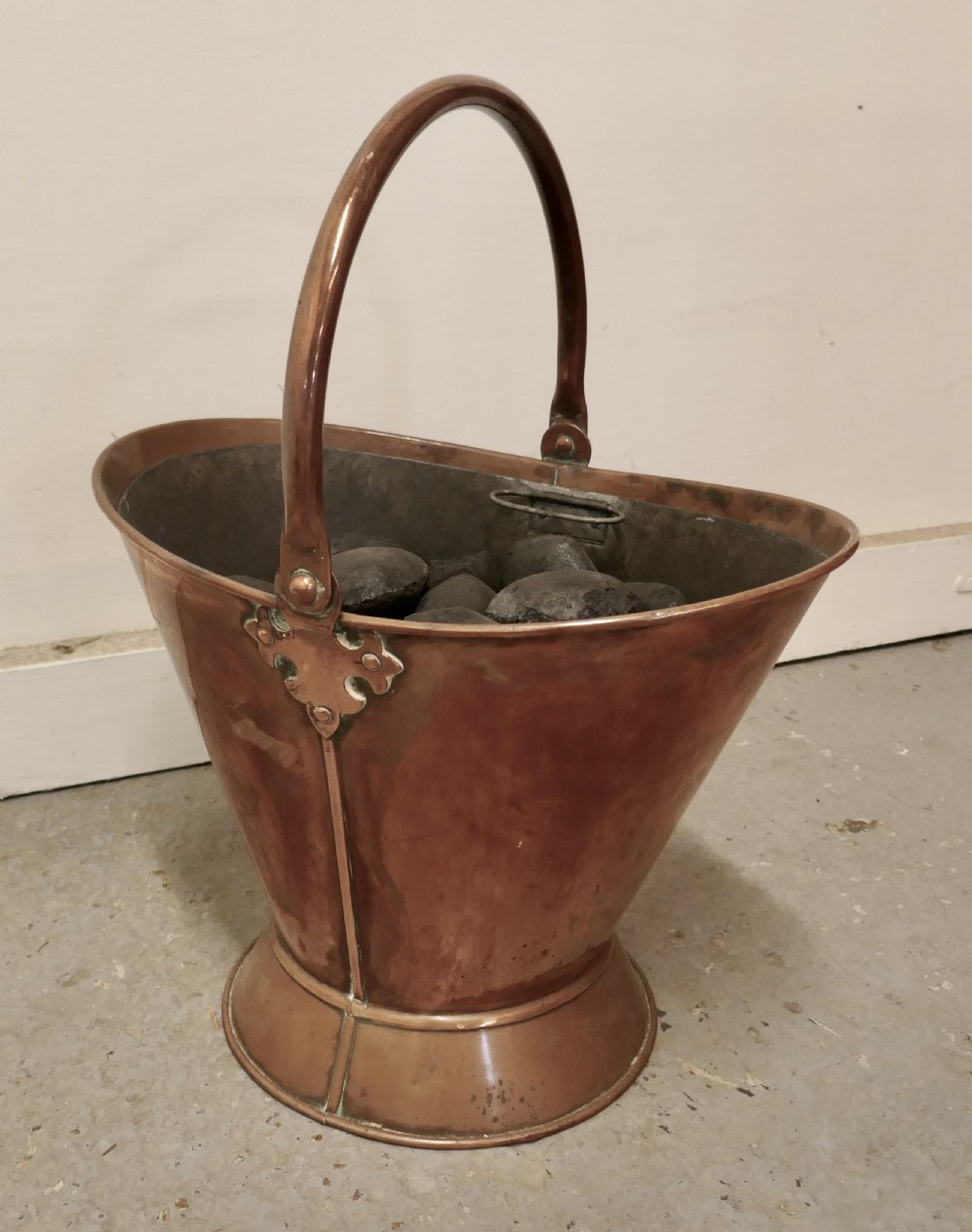 An Art Nouveau Copper Helmet Coal Scuttle with Liner