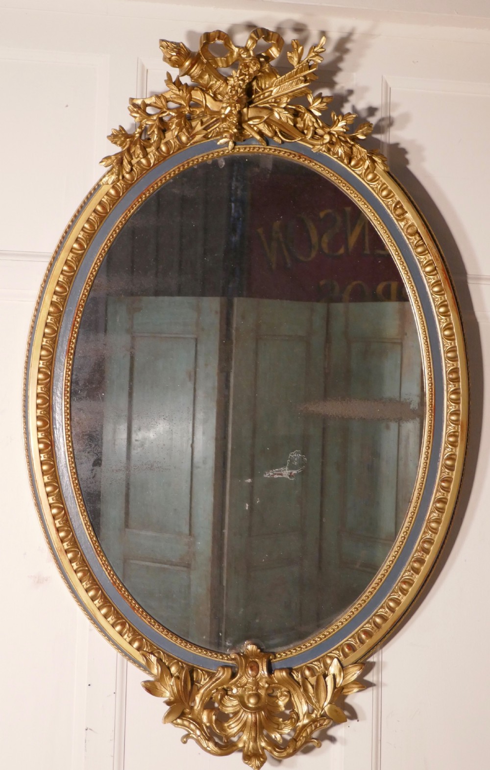 A Large French Rococo Oval Gilt Wall Mirror
