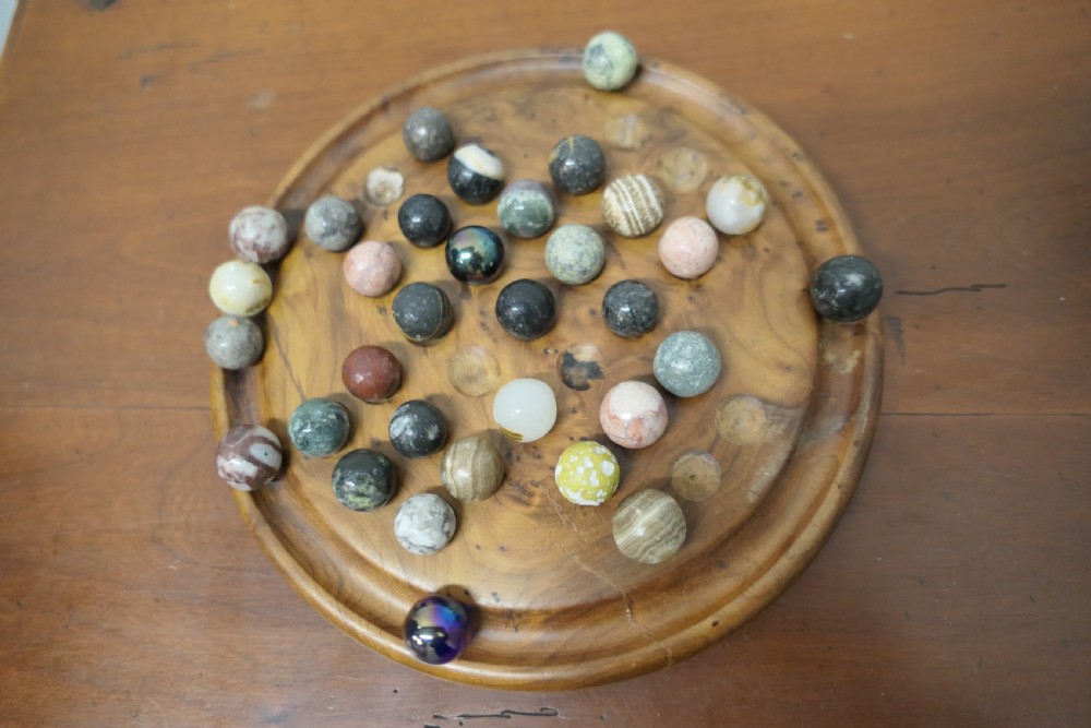 A set of French Marbles on a Turned Solitaire Board View III