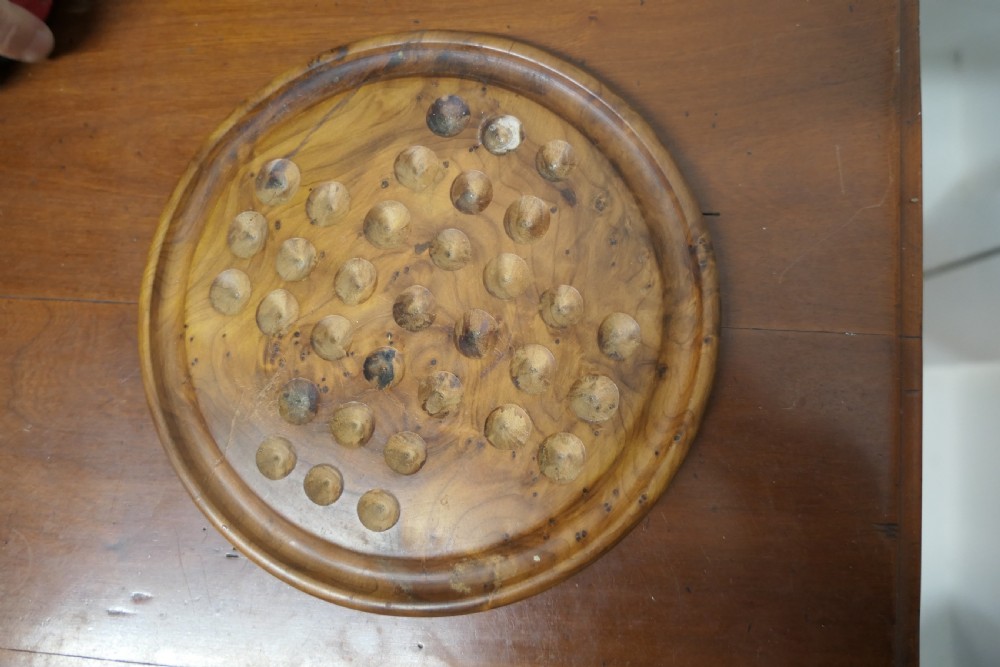A set of French Marbles on a Turned Solitaire Board View IV