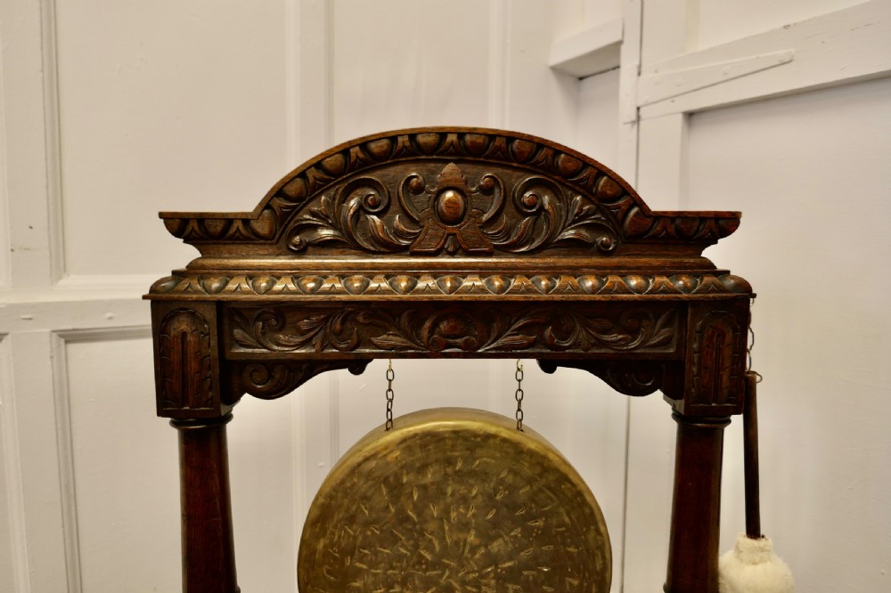 A Large Gothic Carved Oak and Brass Dinner Gong View II