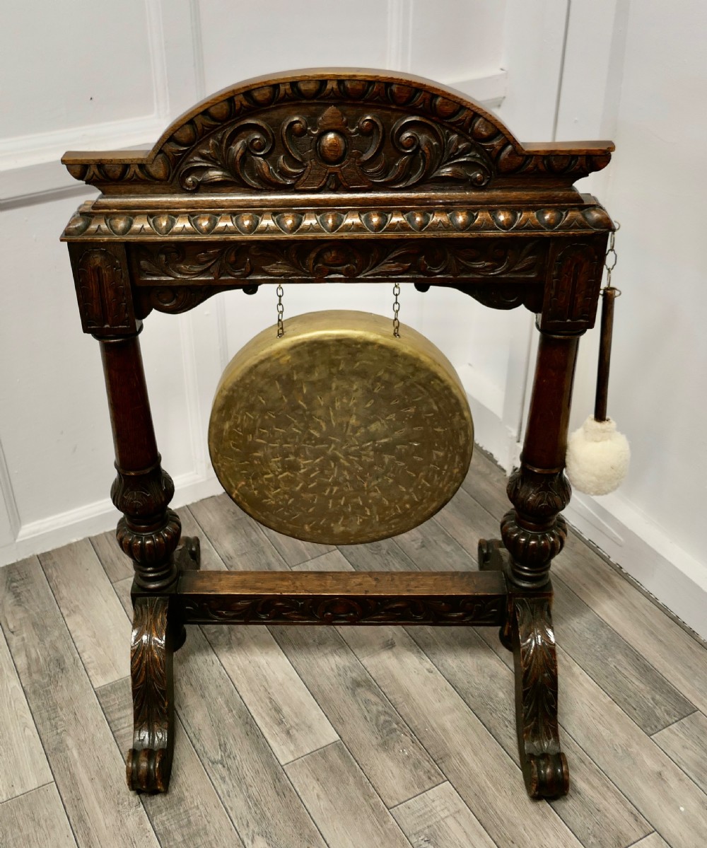 A Large Gothic Carved Oak and Brass Dinner Gong View V