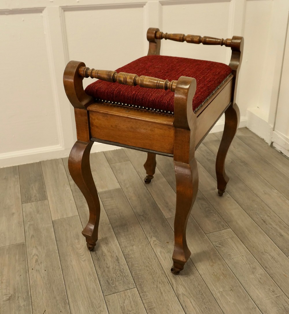 An Edwardian Walnut Piano Stool View V