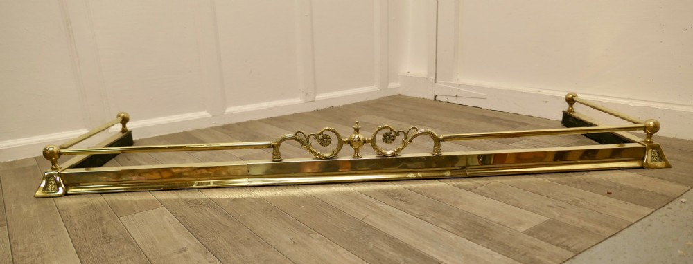 An Art Nouveau Victorian Extending Brass Fender 