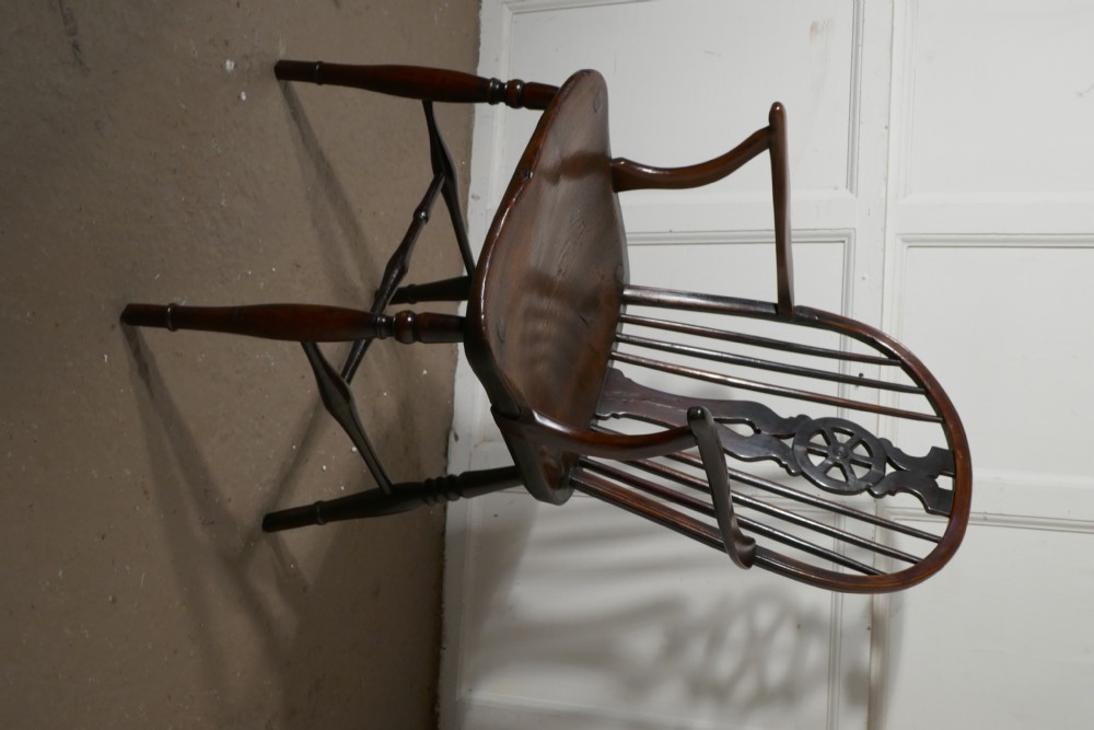 An Early 19th Elm Wheel Back Carver Chair View II
