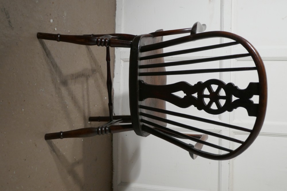 An Early 19th Elm Wheel Back Carver Chair View VI