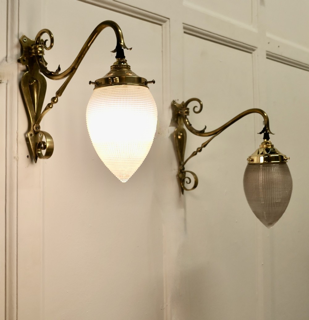 A Pair of Victorian Arts and Crafts Brass Swan Neck Wall Lights,  