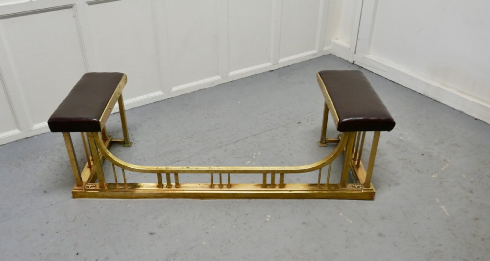 A Large Brass and Leather Club Fender View II