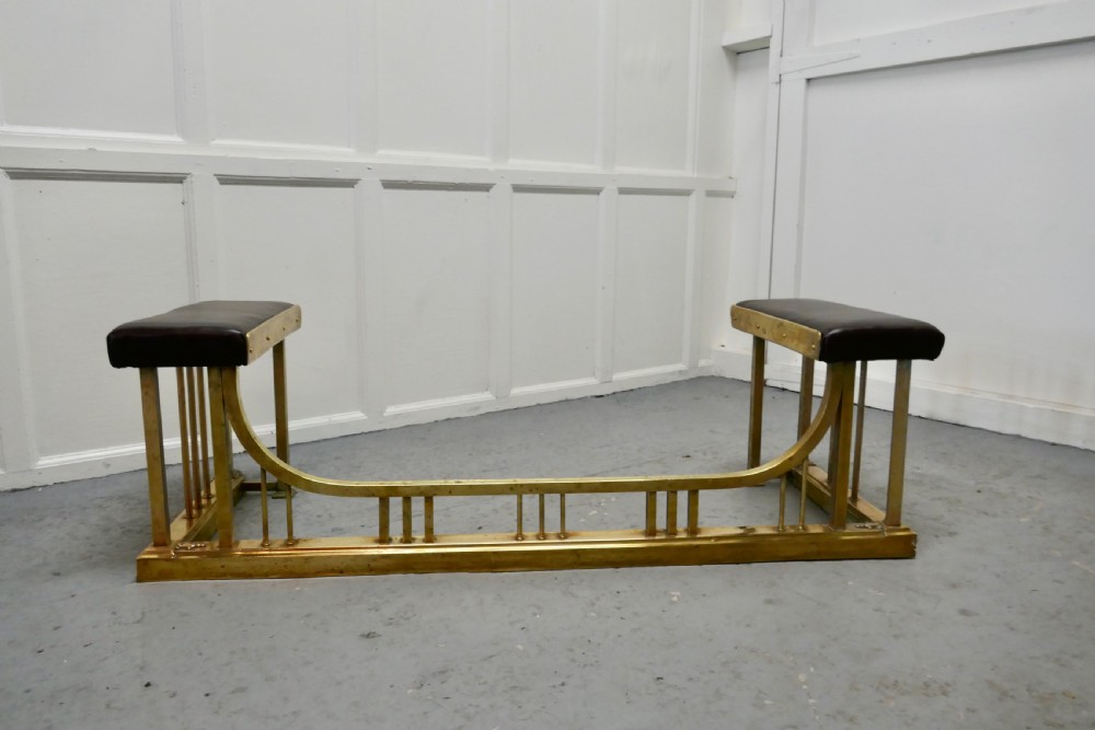 A Large Brass and Leather Club Fender View VI