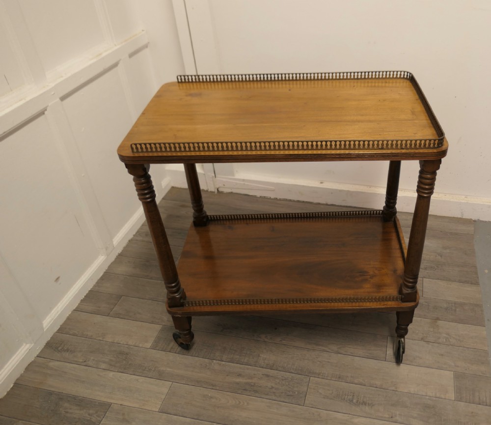 A Superb Walnut 2 Tier Tea Trolley, with Brass Galleries  View VII