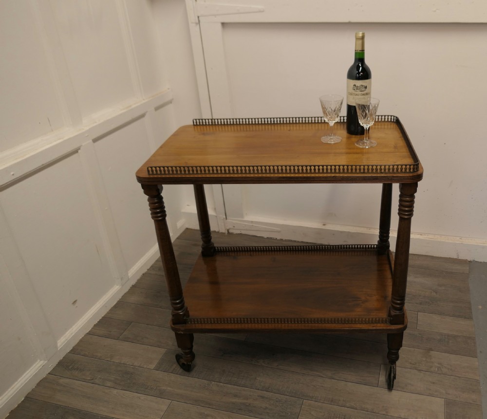 A Superb Walnut 2 Tier Tea Trolley, with Brass Galleries  View VIII
