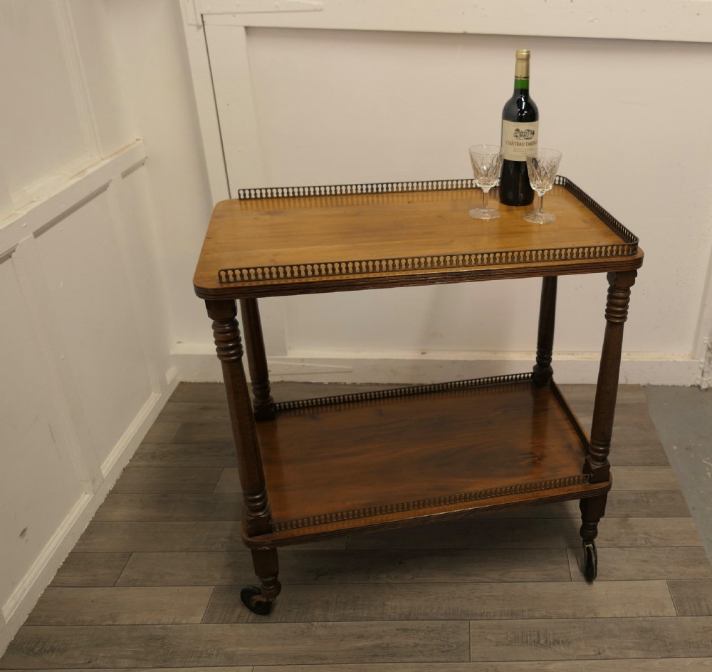 A Superb Walnut 2 Tier Tea Trolley, with Brass Galleries  View IX