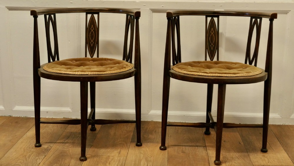 A pair of Edwardian Circular Arm Chairs View II