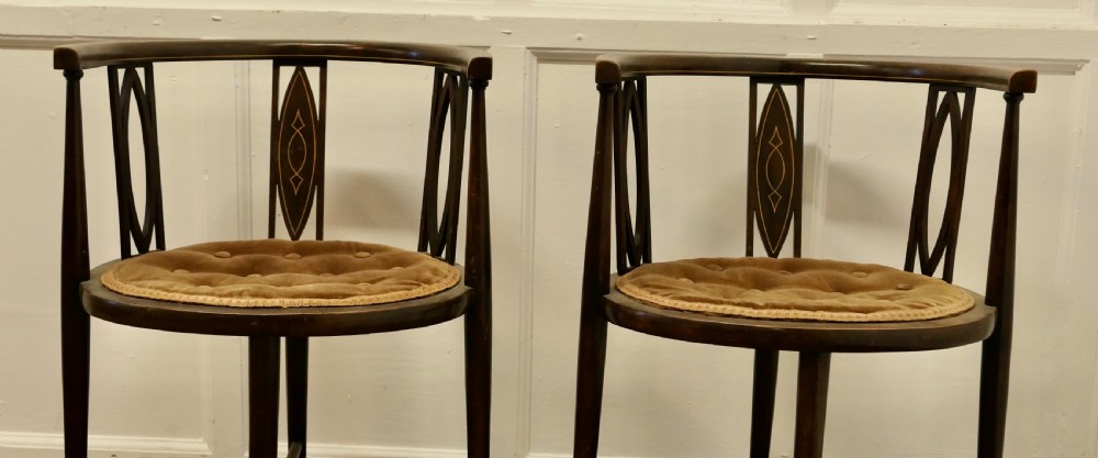 A pair of Edwardian Circular Arm Chairs View III