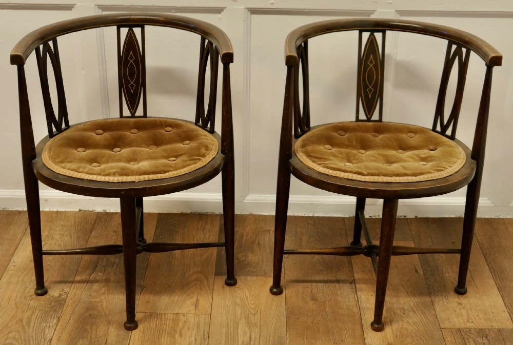 A pair of Edwardian Circular Arm Chairs View IV