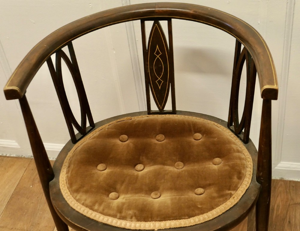 A pair of Edwardian Circular Arm Chairs View V